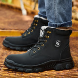 Black 2513 fleece-lined work boots worn on an industrial platform