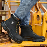 Black 2513 lace-up work boots worn beside industrial equipment, side view