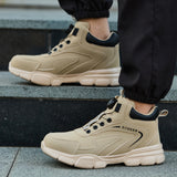 Beige 8012 steel toe work boots with dial closure worn on outdoor steps